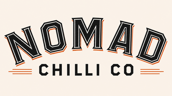 A logo-style graphic reading 'NOMAD CHILLI CO' in black and orange lettering on a light beige background.